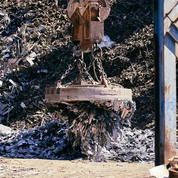Magnet lifting metal scrap in a recycling yard