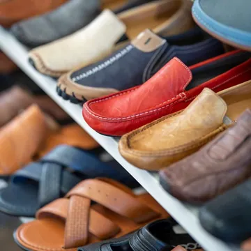 Assorted shoes displayed on shelves