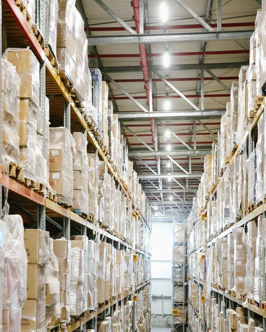 Tall warehouse shelves filled with boxed goods