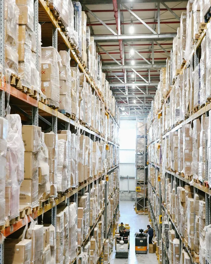 Tall warehouse shelves filled with boxed goods